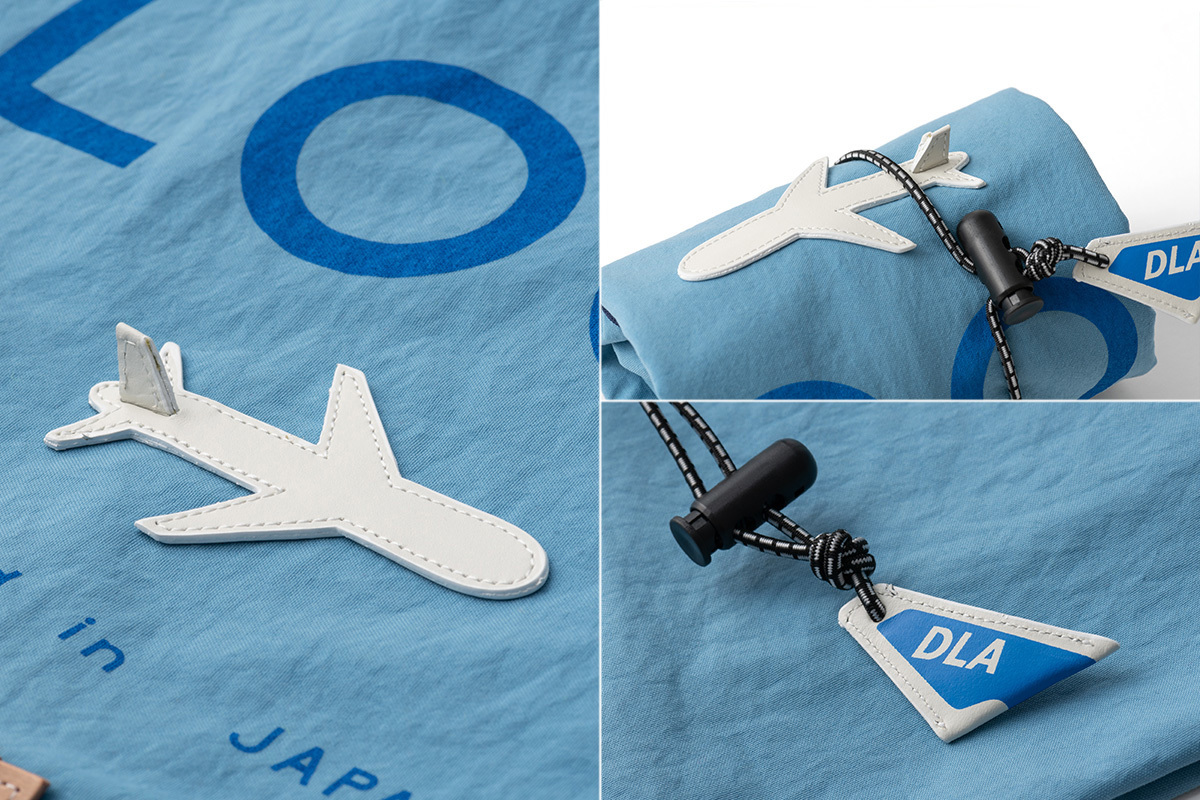 「旅」をテーマに、遊び心あるデザインが随所に。アジャスターの「DLA」(右下)は、DOUBLELOOP AIRLINEの意。「旅への案内人」としての、さすがの演出!